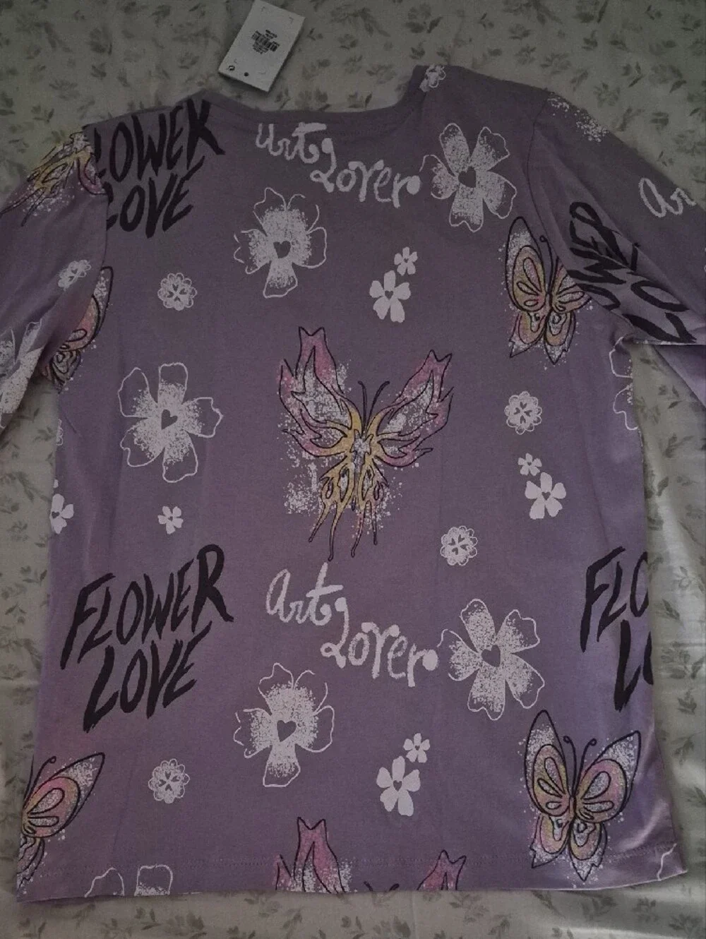 NWT- Primark Care Long Sleeve Top. Lilac Butterfly and Floral Graphic Tee